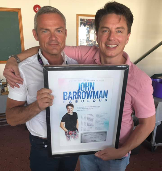 John and Gavin with poster from Cuffe and Taylor
