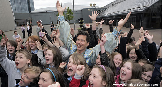 John and children from his old primary school